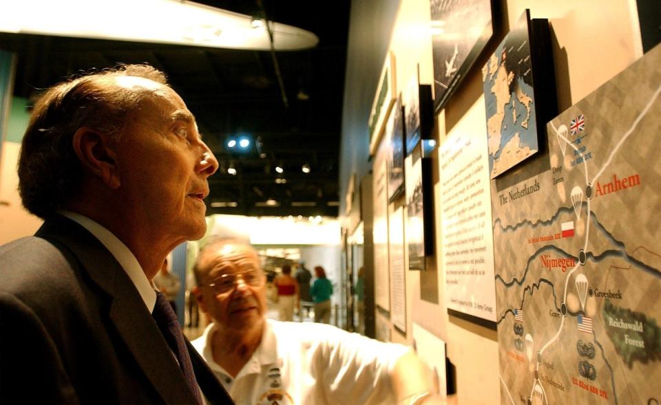 Former U.S. Sen. Bob Dole reads an exhibit during his one-hour visit to the Airborne & Special Operations Museum in Fayetteville in July of 2002. Dole greeted well-wishers and took a tour through the museum.
