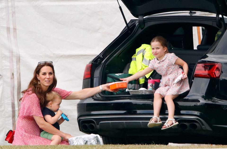 Kate Middleton, Princess Charlotte, and Prince Louis at a polo match