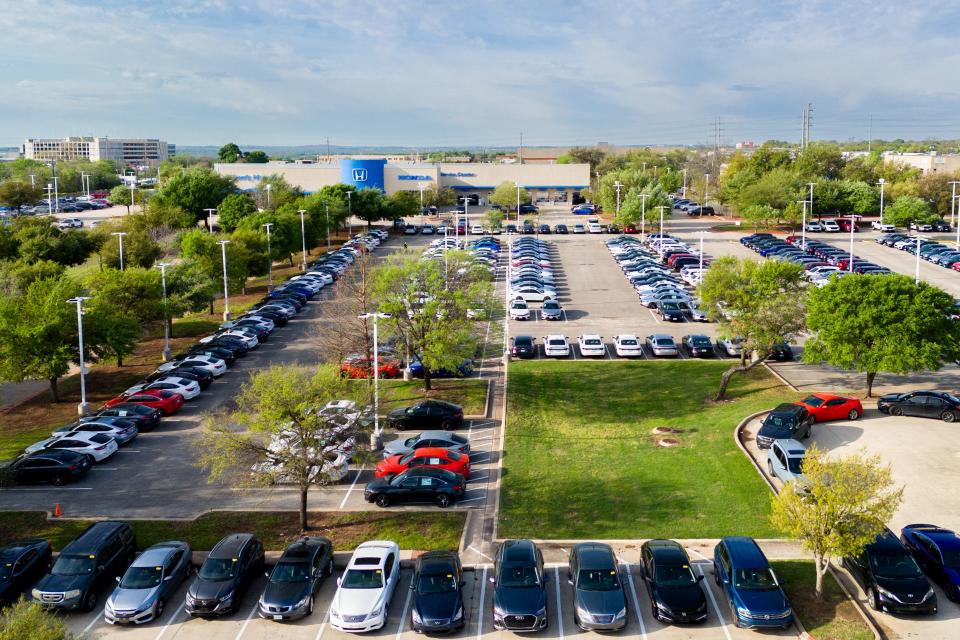 In an aerial view, cars sit on the lot at the Howdy Honda dealership on March 18, 2024 in Austin, Texas.