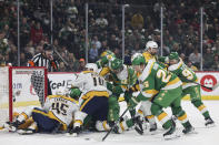 Minnesota Wild defenseman Jonas Brodin (25) advances the puck to the net during the first period of an NHL hockey game against the Nashville Predators, Sunday, March 10, 2024, in St. Paul, Minn. (AP Photo/Stacy Bengs)