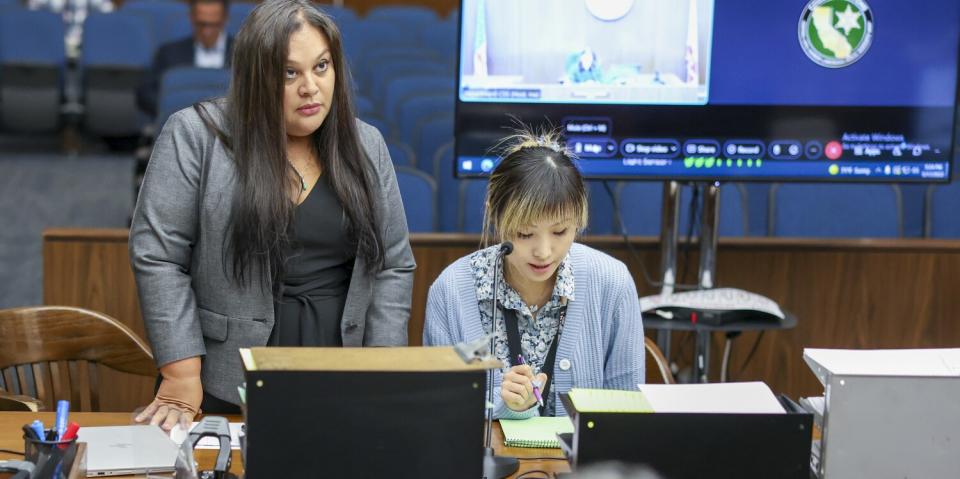 Assistant Public Defender Tania Vallejo and an interpreter, addresses Orange County Superior Court Judge Cynthia Herrera