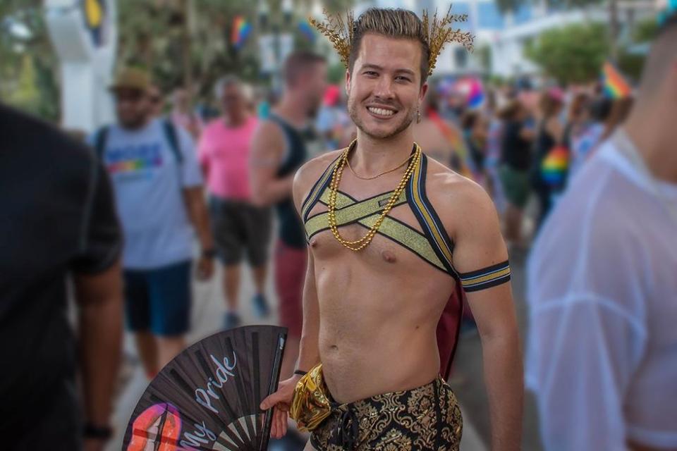 Orlando, Florida. October 12, 2019. Nice man with fan my pride in Come Out With Pride Orlando parade at Lake Eola Park area 131