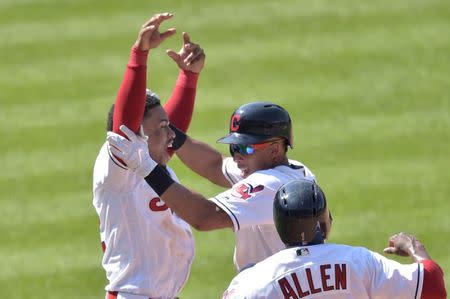 Aug 9, 2018; Cleveland, OH, USA; Cleveland Indians left fielder Michael Brantley, center, celebrates his game-winning hit against the Minnesota Twins with shortstop Francisco Lindor, left, and center field Greg Allen at Progressive Field. Mandatory Credit: David Richard-USA TODAY Sports