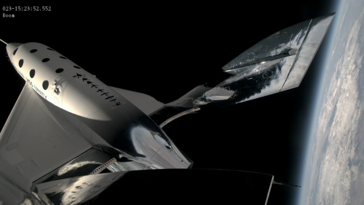 Virgin Galactic spacecraft in suborbital flight above Earth