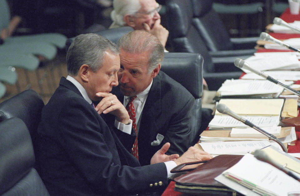 FILE - In this July 15, 1994, file photo Sen. Joseph Biden, D-Del., chairman of the Senate Judiciary Committee, right, huddles with Sen. Orrin Hatch, R-Utah, during a confirmation hearing for Supreme Court nominee Stephen Breyer, on Capitol Hill in Washington. (AP Photo/John Duricka, File)