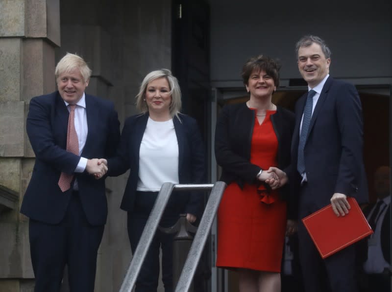 Britain's PM Johnson poses for photographs with Deputy first minister O'Neill, First Minister Foster and Northern Ireland Secretary of State, Smith, in Belfast