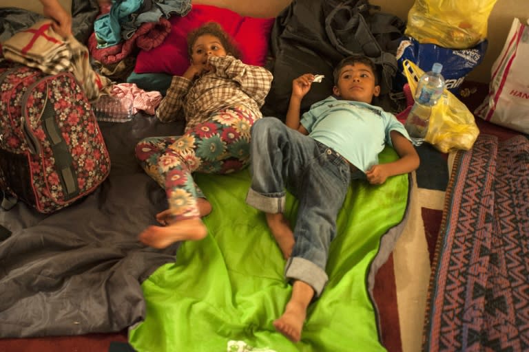 Two migrant children prepare to sleep in a Macedonian mosque in Kumanovo, 10 kilometers from the Serbian border, on June 17, 2015