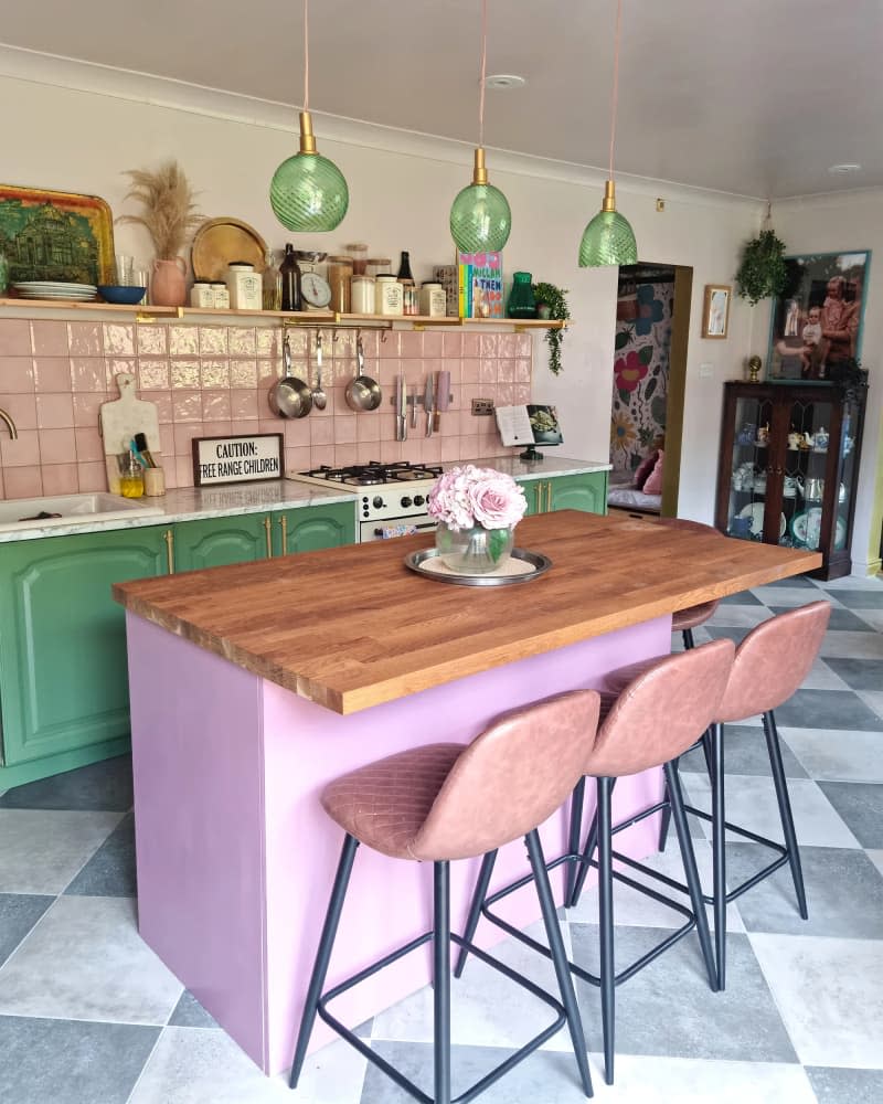 Butcher block countertops on a kitchen island in a newly remodeled home.