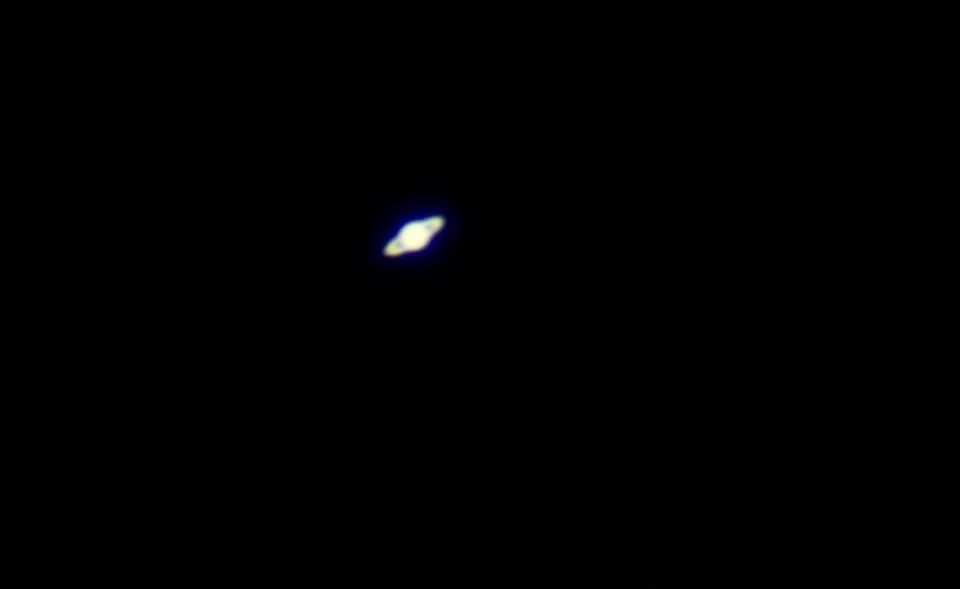 Saturn captured in prime focus, meaning the camera lens was removed and the camera was attached directly to the telescope when this image was shot.