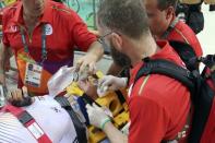 2016 Rio Olympics - Cycling Track - Final - Men's Omnium 40km Points Race - Rio Olympic Velodrome - Rio de Janeiro, Brazil - 15/08/2016. Park Sang-Hoon (KOR) of South Korea is assisted by medical personnel after crashing. REUTERS/Eric Gaillard