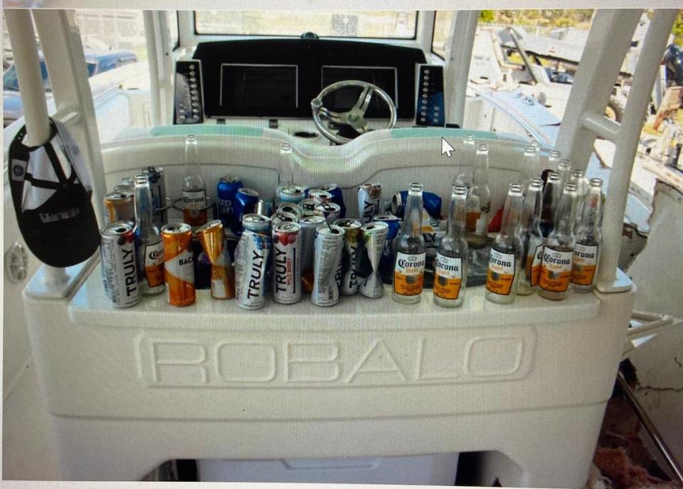 Empty beer and other alcoholic beverage bottles and cans are lined up behind the cockpit of George Pino’s 29-foot Robalo boat on Sept. 5, 2022. the day after Pino crashed into a channel marker in Biscyane Bay, leading to the death of a 17-year-old girl and brain injury to another girl on the boat. Florida Fish and Wildlife Conservation Commission