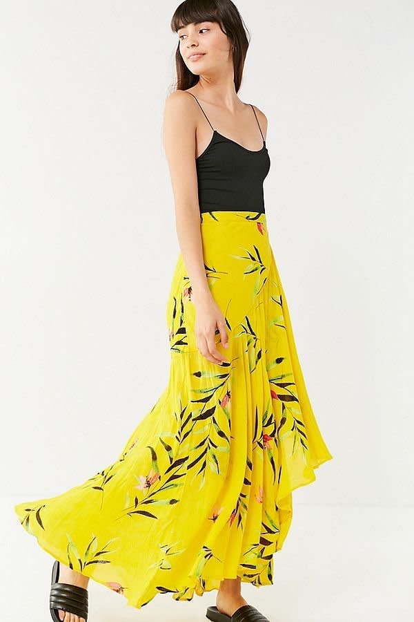 Get it at <a href="https://www.urbanoutfitters.com/shop/uo-rashida-asymmetrical-maxi-wrap-skirt?category=SEARCHRESULTS&amp;color=072" target="_blank">Urban Outfitters</a>, $79.