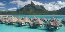 <p><a href="https://www.bestproducts.com/fun-things-to-do/g2851/exotic-overwater-bungalows/" rel="nofollow noopener" target="_blank" data-ylk="slk:Over-the-water bungalows;elm:context_link;itc:0;sec:content-canvas" class="link ">Over-the-water bungalows</a> just scream tropical island paradise. In this case, that paradise is <a href="https://www.tripadvisor.com/Hotel_Review-g311415-d597947-Reviews-The_St_Regis_Bora_Bora_Resort-Bora_Bora_Society_Islands.html" rel="nofollow noopener" target="_blank" data-ylk="slk:The St. Regis Bora Bora Resort;elm:context_link;itc:0;sec:content-canvas" class="link ">The St. Regis Bora Bora Resort</a> in French Polynesia, <a href="https://www.nationalgeographic.com/travel/features/best-trips-2019/" rel="nofollow noopener" target="_blank" data-ylk="slk:named a 2019 hotspot;elm:context_link;itc:0;sec:content-canvas" class="link ">named a 2019 hotspot</a>. </p><p>In this honeymoon destination, you can snorkel in the turquoise waters of Bora Bora's lagoon, indulge in traditional <em>taurumi</em> massages (where a masseuse gently massages the body with coconut oil), and lounge on the beach sipping frozen drinks. As the sun sets, dine in <a href="https://www.tripadvisor.com/Restaurant_Review-g311415-d1382225-Reviews-Lagoon_Restaurant_by_Jean_Georges-Bora_Bora_Society_Islands.html" rel="nofollow noopener" target="_blank" data-ylk="slk:Lagoon Restaurant;elm:context_link;itc:0;sec:content-canvas" class="link ">Lagoon Restaurant</a> from Michelin-starred chef Jean-Georges Vongerichten.<br></p>