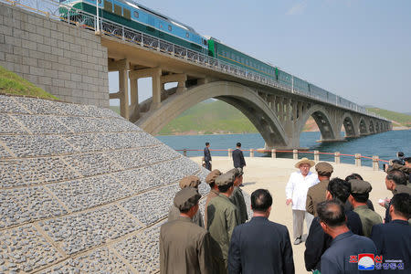 FILE PHOTO: North Korean leader Kim Jong Un inspects the completed railway that connects Koam and Dapchon, in this undated photo released by North Korea's Korean Central News Agency (KCNA) in Pyongyang May 24, 2018. KCNA/via REUTERS/File Photo