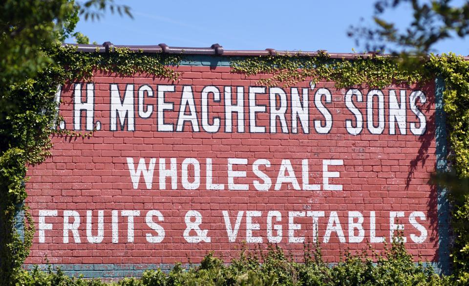 "W. H. McEachern Sons Wholesale Fruits & Vegetables" is painted on the side of the building at 121 s. Front St. in downtown Wilmington.     [MATT BORN/STARNEWS]