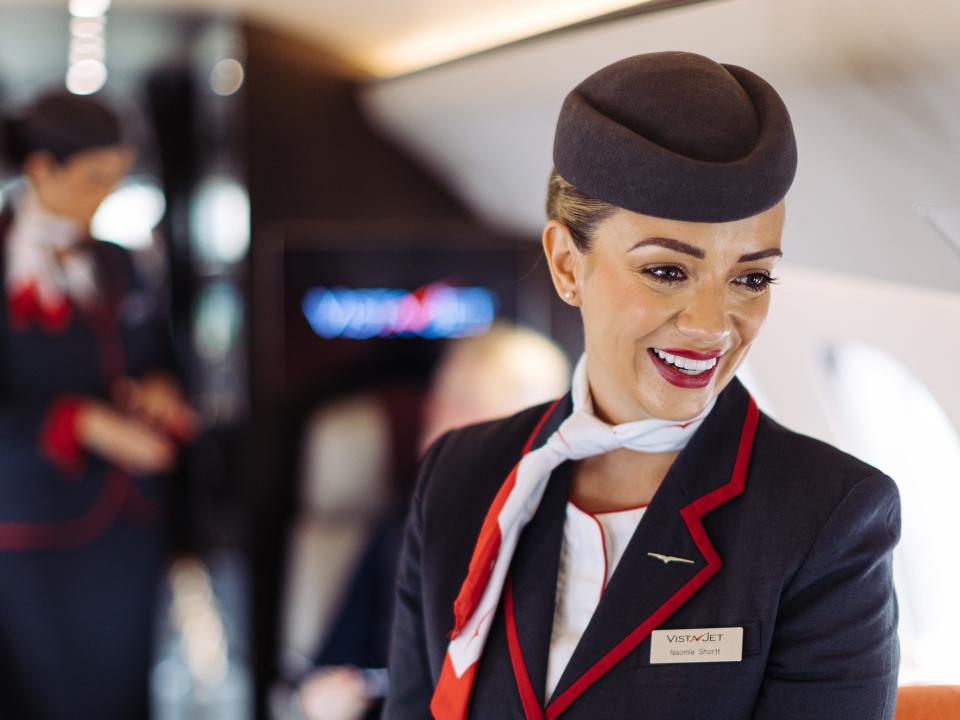 Naomi, a VistaJet cabin host, smiles on board a Bombardier Global 7500 at Farnborough Airprot