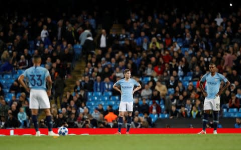 Manchester City's John Stones, Fernandinho and Gabriel Jesus look dejected after conceding the second goal  - Credit: Reuters