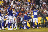 New York Giants quarterback Daniel Jones (8) stands up and running in to score a touchdown against the Washington Football Team during the first half of an NFL football game, Thursday, Sept. 16, 2021, in Landover, Md. (AP Photo/Alex Brandon)