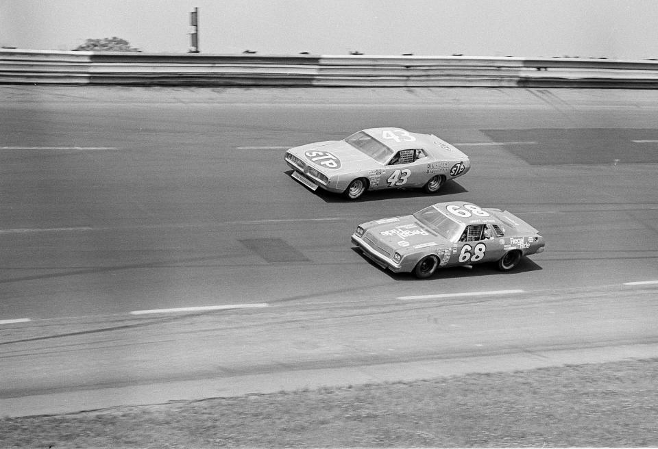 FILE - Richard Petty (43) and Janet Guthrie (68) compete during the World 500 in Charlotte, N.C., May 30, 1976. Janet Guthrie spent her entire lifetime battling gender stereotypes in a fight she nearly always won by proving that being a woman would not hold her back in any of her pursuits. (AP Photo/Harold Valentine)
