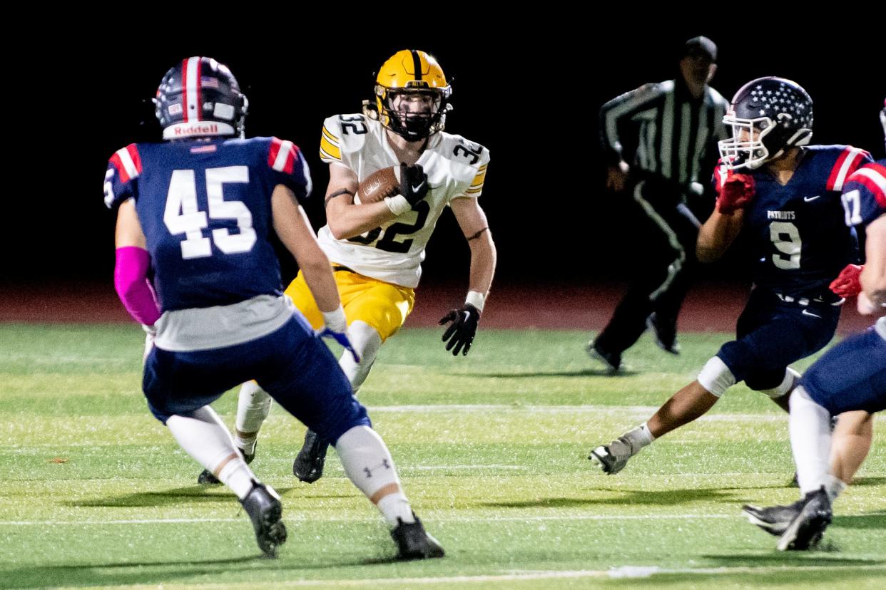 Central Bucks West punt returner Matt Cleland runs the ball down the middle in a rivalry football game against Central Bucks East at Patriots Stadium in Buckingham, on Friday, October 28, 2022. The Bucks defeated the Patriots 21-14.