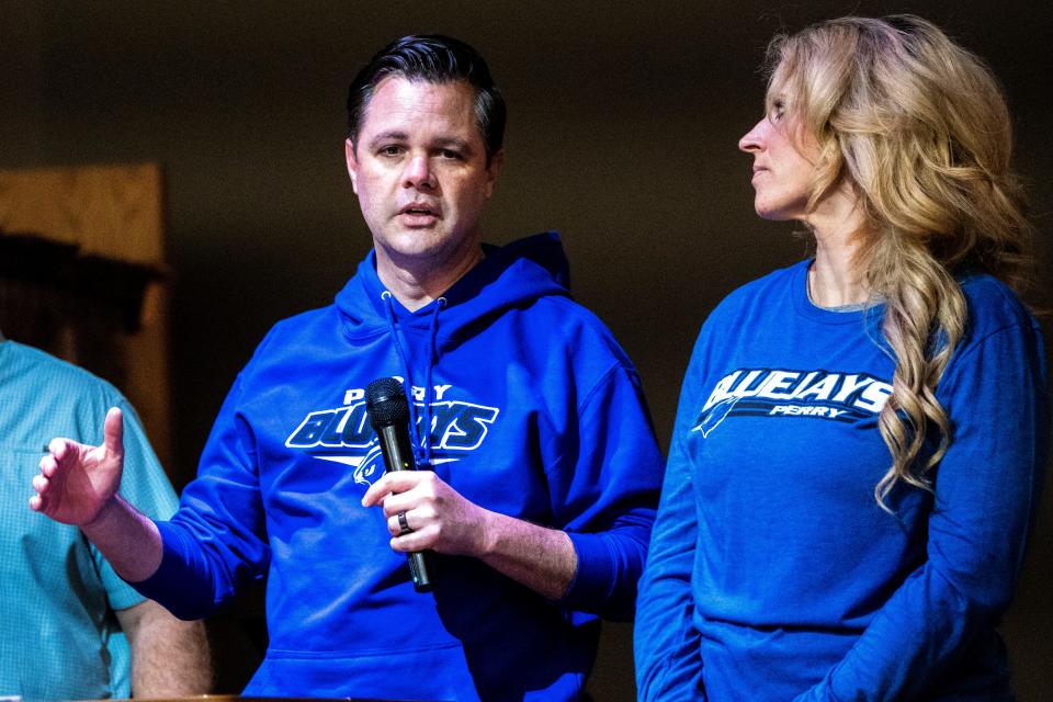 U.S. Rep Zach Nunn, joined by his wife Kelly, speaks to the congregation during a vigil at Crossroads Church on Thursday, Jan. 4, 2024, in Perry.