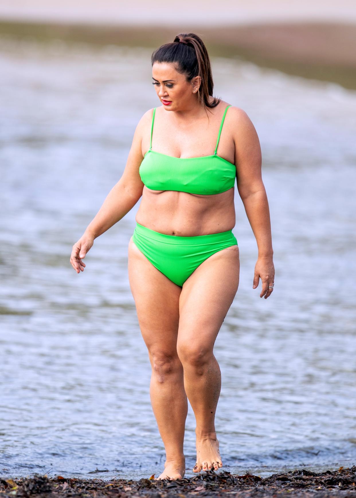 MAFS bride Mishel Meshes cools off in the Sydney heat by taking a dip in a lime green bikini. Photo: DIIMEX.