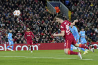 Liverpool's Diogo Jota heads the ball to score his side's first goal during the Champions League group B soccer match between Liverpool and Atletico Madrid in Liverpool, England, Wednesday, Nov. 3, 2021.(AP Photo/Jon Super)