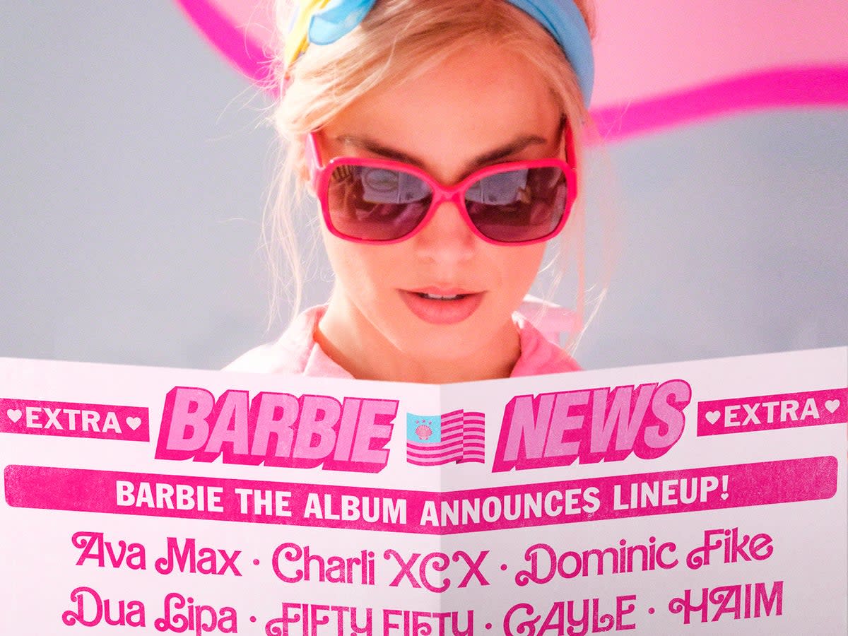 Margot Robbie’s Barbie surveys the track listing of her soundtrack album  (Atlantic Records)