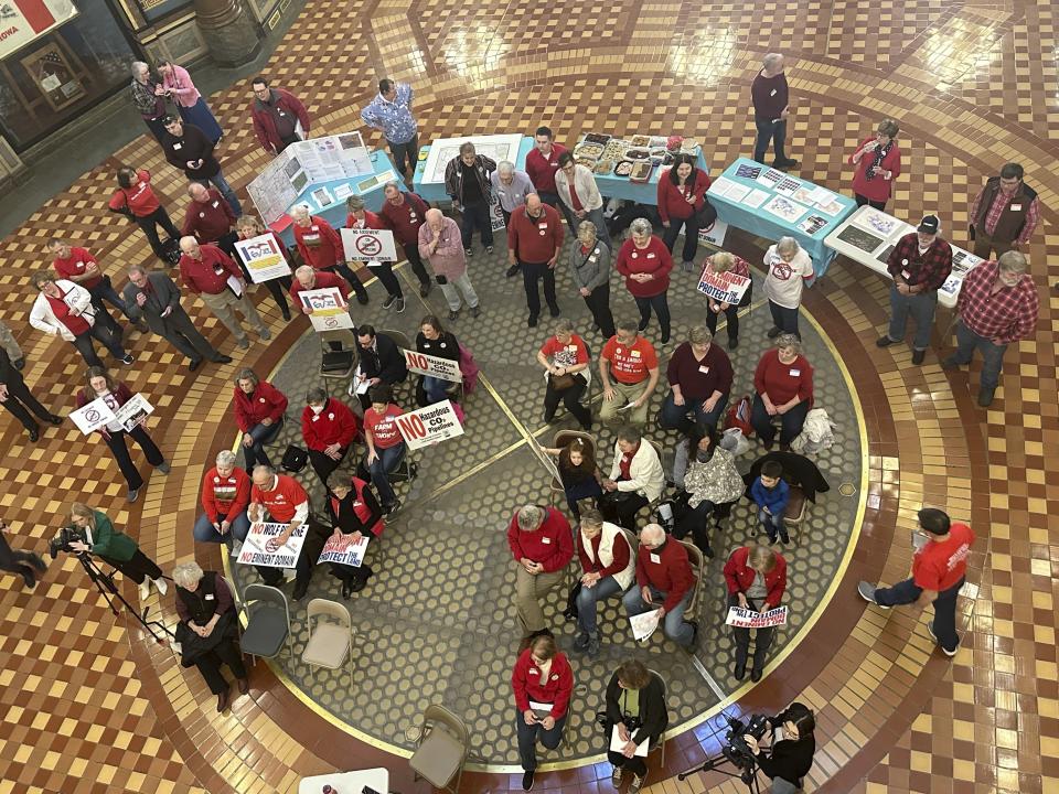 Opponents of Summit Carbon Solutions' proposed carbon dioxide pipeline gather at the state Capitol in Des Moines, Iowa, on Feb. 8, 2024. The Iowa Utilities Board on Tuesday, June 25, 2024, approved Summit's application to build its pipeline, but the company still has many hoops to jump through before it gets its permit and can begin construction. (AP Photo/Hannah Fingerhut)