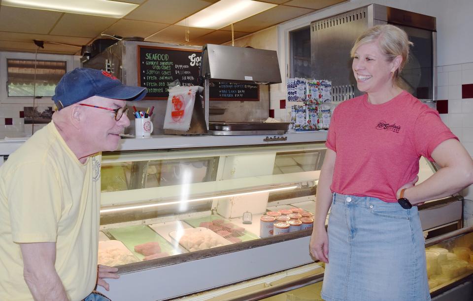 John Gordon, left, and Kerri Corderman display the offerints at Gordon's Grocery's popular deli.