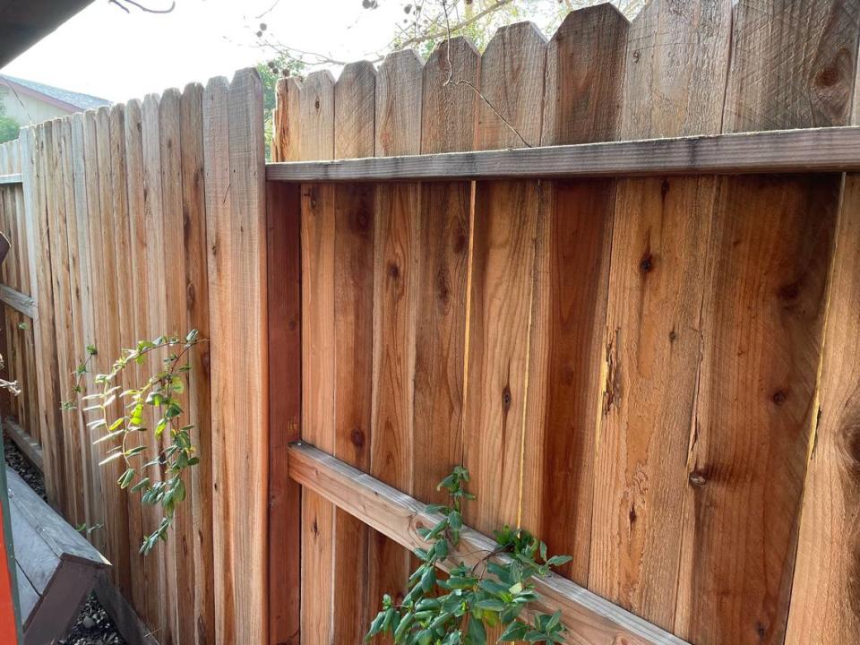 In this good-neighbor fence, the 8-foot lengths alternate between the front and back facing each resident’s property. That ensures equal responsibility for replacing boards, posts and supports as necessary.