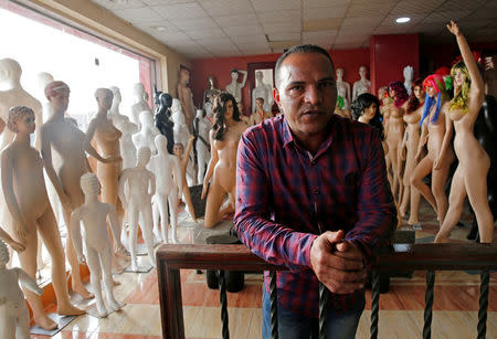 Mohamed al-Shabini, 44, poses for a photograph at his gallery in Al Kharqani village, El-Kalubia governorate, north of Cairo, Egypt, March 23, 2017. REUTERS/Amr Abdallah Dalsh