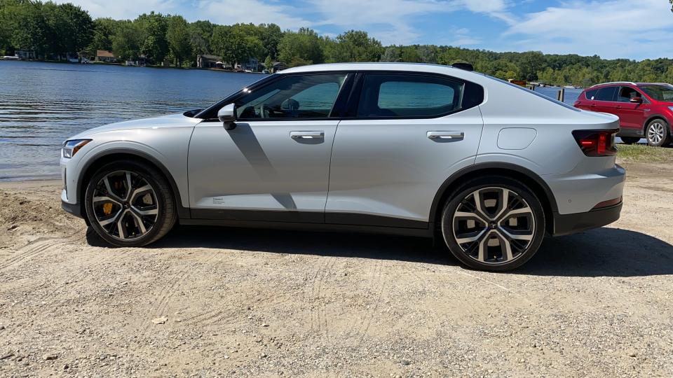 The 2021 Polestar 2 electric car has a long hood and roofline, 4.45-second 0-60 mph acceleration and responsive handling.