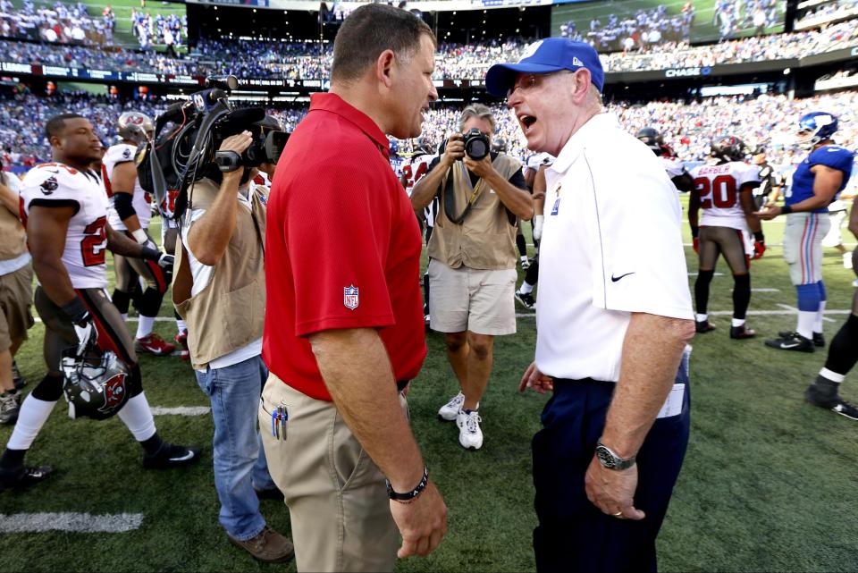 Greg Schiano (L) got an earful from Tom Coughlin in 2012 after a heated conclusion to a Bucs-Giants game in which Tampa blew up New York's victory formation. (AP) 