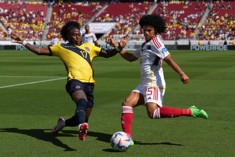 Jun 22, 2024; Santa Clara, CA, USA; Ecuador defender Angelo Preciado (17) and Venezuela forward Eduardo Bello (right) reach for the ball during the second half at Levi's Stadium. Mandatory Credit: Darren Yamashita-USA TODAY Sports