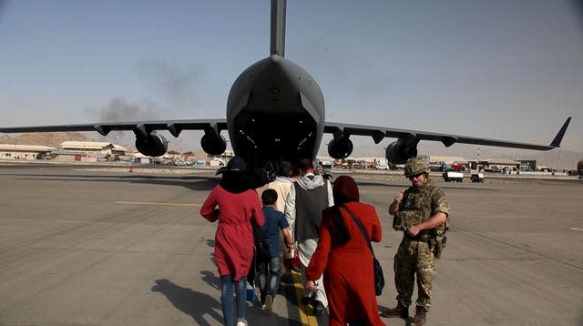 Captain Muraal at Kabul airport as she boards a British military plane to be evacuated to the UK from Afghanistan