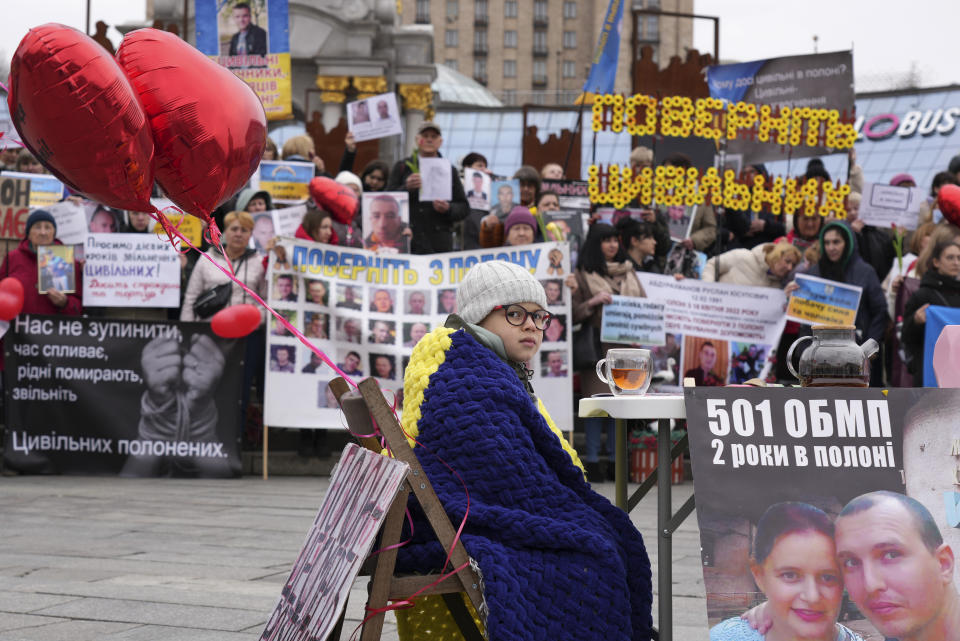 A young boy, whose father is a Ukrainian prisoner of war attends a vigil in Maidan Square in central Kyiv, Ukraine, Saturday March 16, 2024. (AP Photo/Tony Hicks)