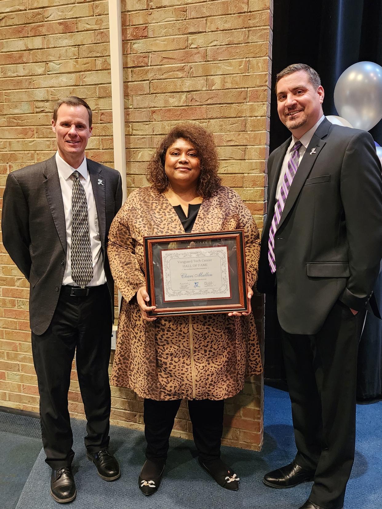 Vanguard Superintendent Greg Edinger and Director Dave Buening stand with Hall of Fame Inductee Chari Mullen.