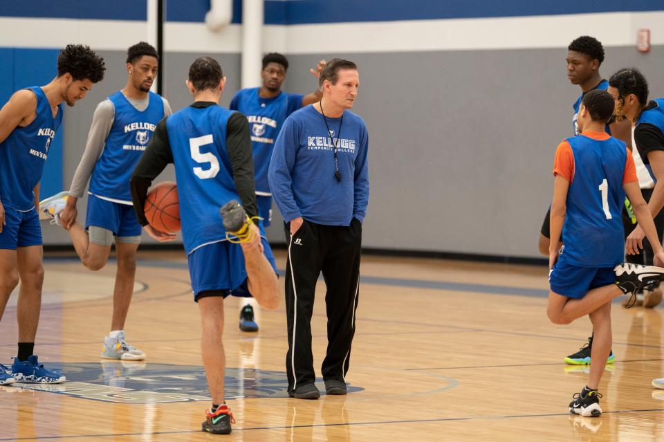 Kellogg Community College coach Steve Proefrock works with players during a practice at Kellogg Community College in Battle Creek on Thursday, March 2, 2023. KCC will begin its postseason on Tuesday.