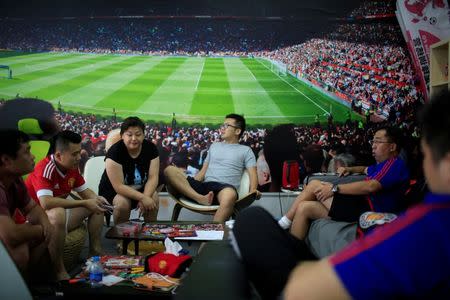 Fans of Manchester United Shanghai fan club chat at their club in Shanghai, China July 16, 2016. Picture taken July 16, 2016. REUTERS/Aly Song