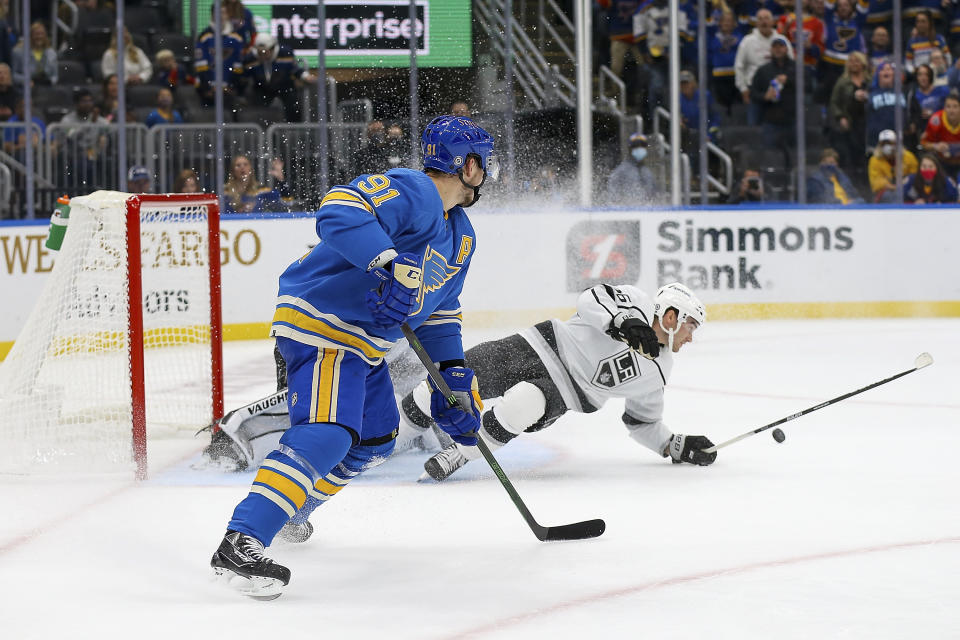 St. Louis Blues' Vladimir Tarasenko (91) looks on a Los Angeles Kings' Sean Walker (26) defends during the second period of an NHL hockey game Saturday, Oct. 23, 2021, in St. Louis. (AP Photo/Scott Kane)