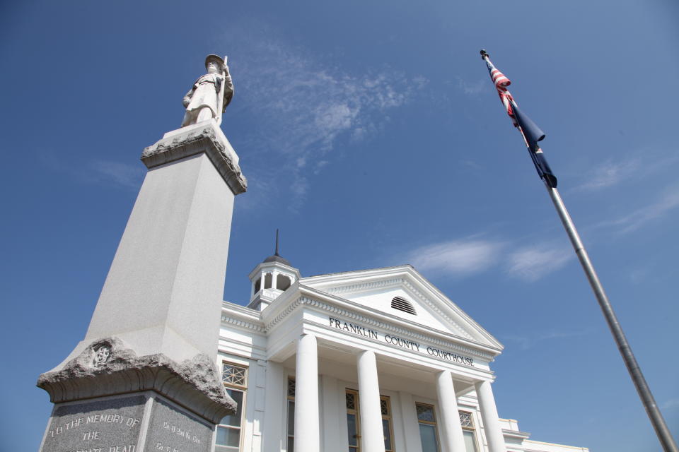 This July 6, 2020 photo shows a monument to Franklin County’s Confederate dead standing outside the courthouse in Rocky Mount, Va. In Virginia, Richmond’s mayor removed massive statues in the Confederacy’s former capital, headlining a tally of at least a dozen monuments removed from public land statewide since George Floyd’s death. In Virginia's rural Franklin County, the Board of Supervisors put a non-binding referendum on relocating the statue to voters in the Republican-leaning, majority-white county. The final decision will still lie with the board after the November election. (AP Photo/ Sarah Blake Morgan)