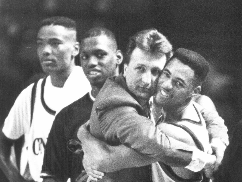 Cincinnati coach Bob Huggins hugs guard Anthony Buford during the final seconds of a victory over Memphis State on March 29, 1992. The win put the Bearcats into the Final Four.