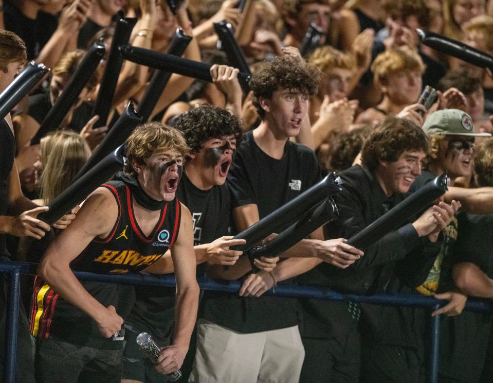 Gulf Breeze football fans cheer on their team during play against the Pace Patriots at Dolphin Stadium Friday, September 29, 2023.