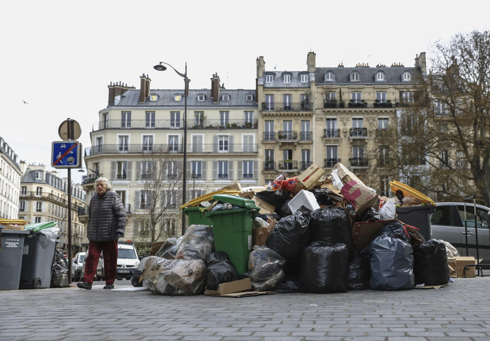 FILE - Uncollected garbage is piled up on a street in Paris, March 20, 2023, as sanitation workers continue to strike. (AP Photo/Aurelien Morissard, File)