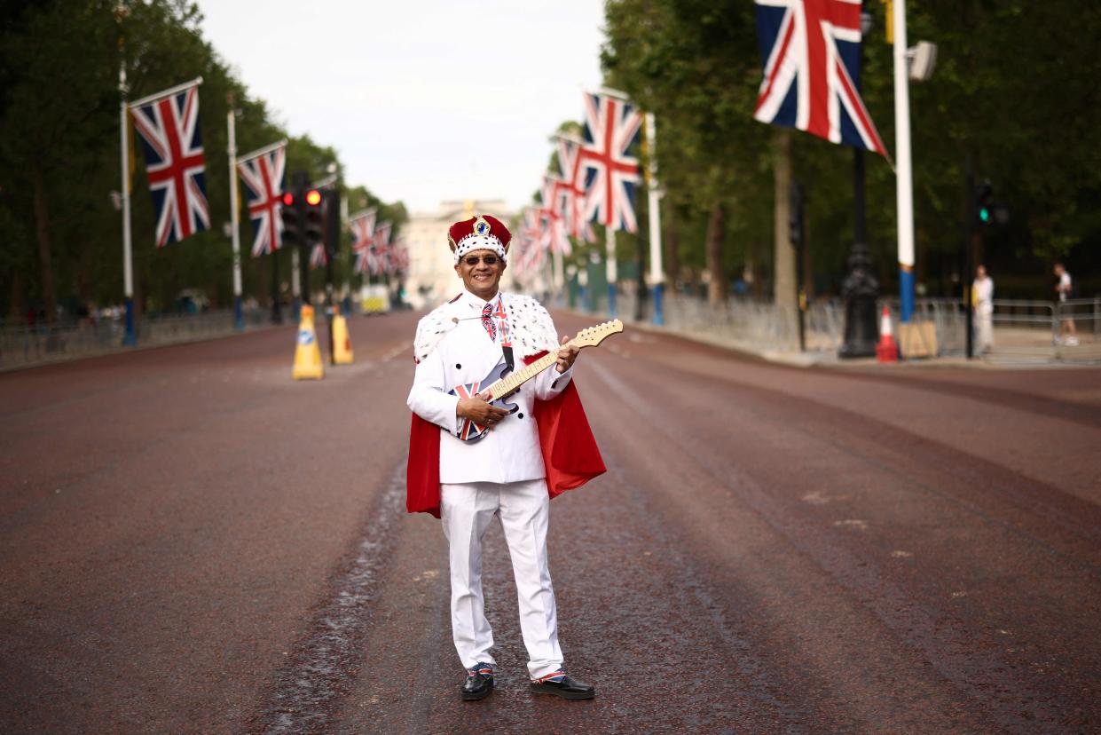 Royal Fan Andrew Thompson poses on The Mall prior to the King's Birthday Parade (AFP via Getty Images)