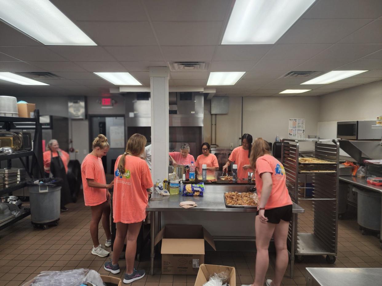 Students from The Epiphany School in New Bern recently volunteered in the Community Kitchen at RCS.