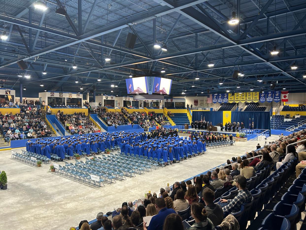 Students standing at attention to begin the graduation ceremony during the 2023 LSSU commencement ceremony at Taffy Abel Arena on May 6, 2023.