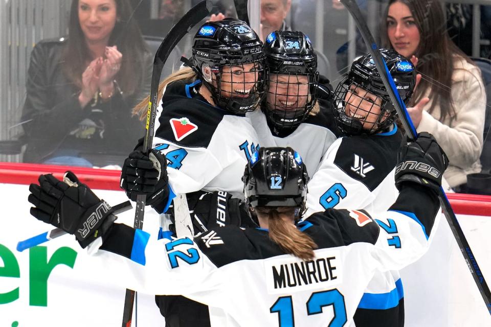 PWHL Toronto's Hannah Miller, back centre, celebrates her first-period goal with Natalie Spooner, left, Allie Munroe and Kali Flanagan during a 2-1 win over Montreal on Sunday at PPG Paints Arena in Pittsburgh.