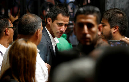 Venezuelan opposition leader Juan Guaido, who many nations have recognized as the country's rightful interim ruler, leaves after the meeting with public employees in Caracas, Venezuela March 5, 2019. REUTERS/Carlos Jasso